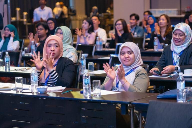 Cross-industry professionals collaborating at Asian change conference